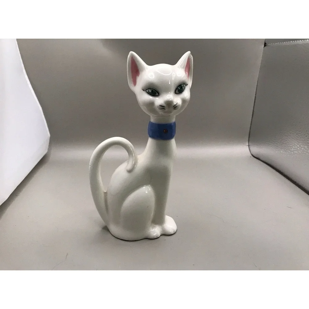 Pretty White Porcelain‎ Kitty With Green Eyes And A Blue Collar